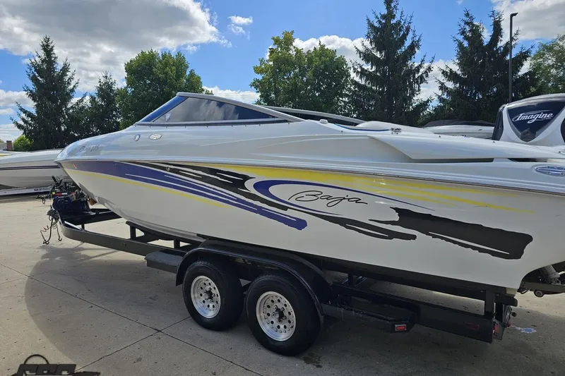 Slide: The Image of 2005 Baja 275 boat on trailer, featuring sleek design and vibrant graphics. - 25