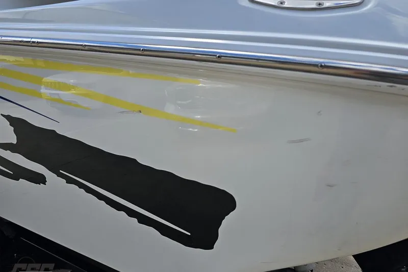 Slide: The Image of 2005 Baja 275 boat with sleek graphics and polished metal trim. - 26