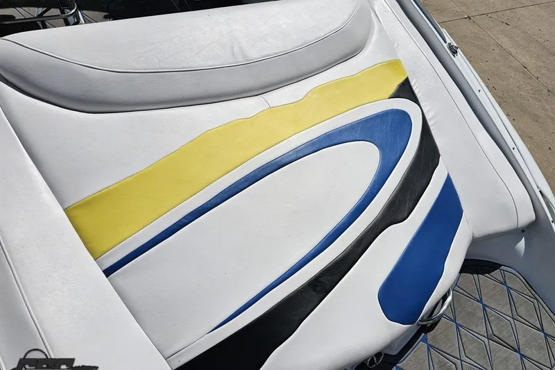 Slide: The Image of 2005 Baja 275 boat seat with colorful yellow, blue, and black design. - 34