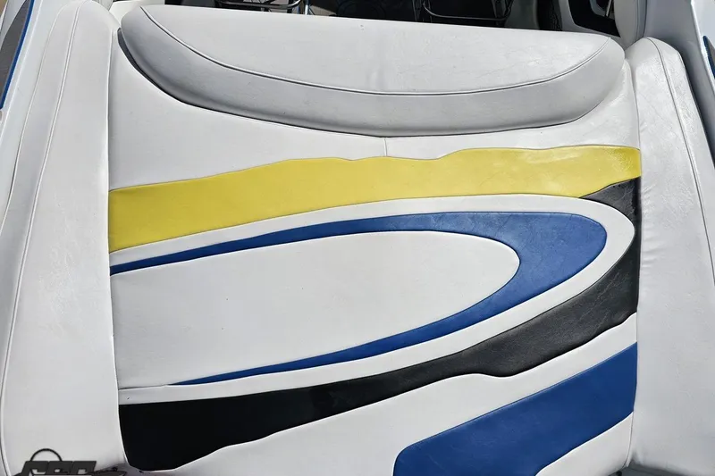 Slide: The Image of 2005 Baja 275 boat seat with colorful abstract design in yellow, blue, and black. - 36
