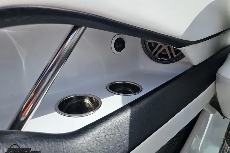 Slide: The Image of Interior of 2005 Baja 275 boat with cup holders and JL Audio speaker. - 54