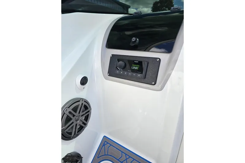 Slide: The Image of 2005 Baja 275 boat dashboard with Fusion Link audio system and speaker. - 59