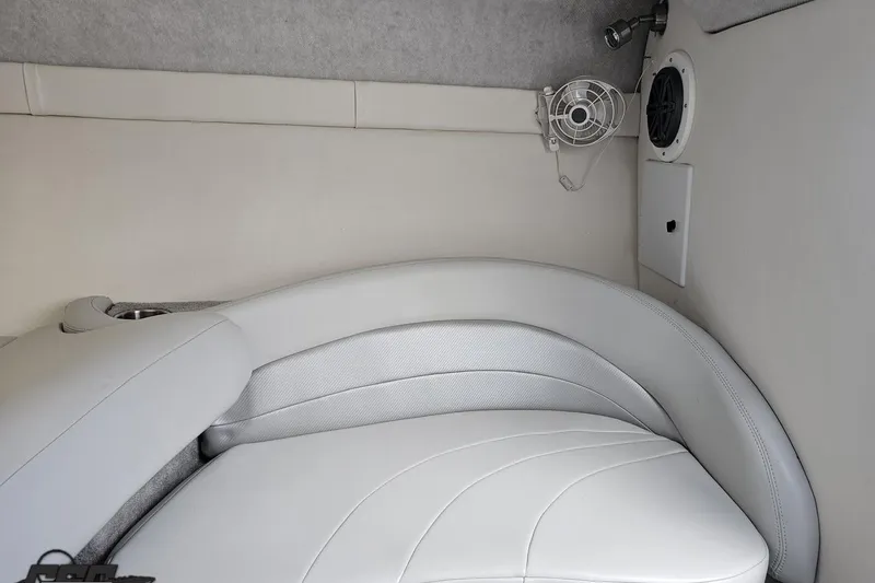 Slide: The Image of 2005 Baja 275 boat interior with white leather seating and speaker system. - 75
