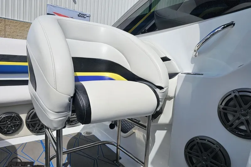 Slide: The Image of 2005 Baja 275 boat interior with white and black seating, speakers, and chrome accents. - 84