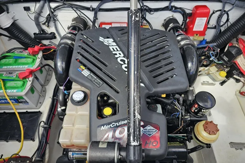 Slide: The Image of 2005 Baja 275 boat engine compartment with MerCruiser engine and dual batteries. - 98