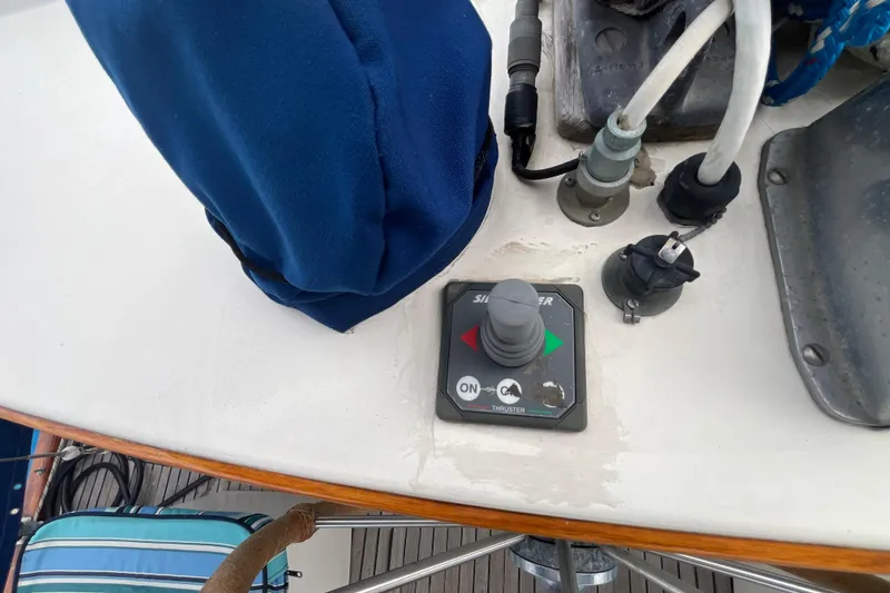 Slide: The Image of Control panel on a 1986 Nauticat 33' sailboat deck, featuring a thruster switch. - 19