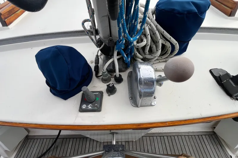 Slide: The Image of Cockpit controls of a 1986 Nauticat 33' sailboat, featuring ropes and navigation equipment. - 20
