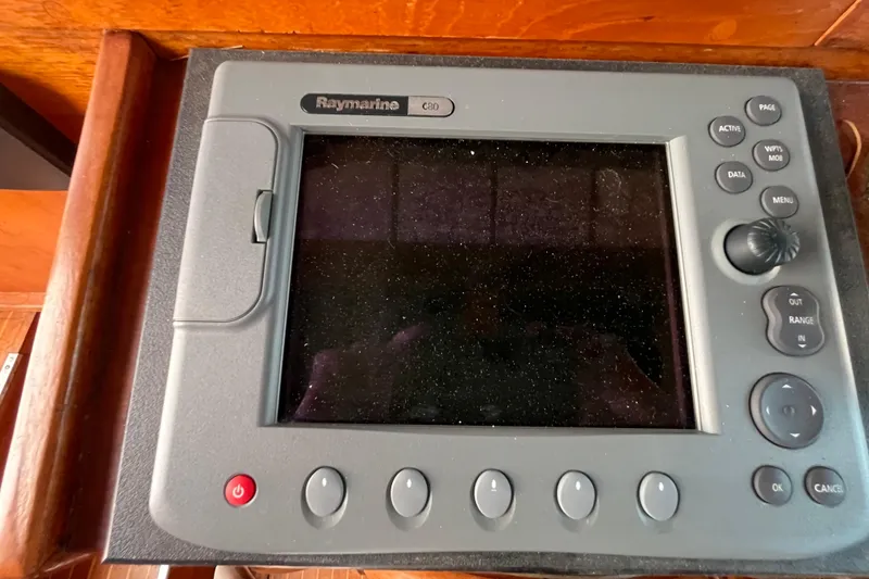 Slide: The Image of Raymarine navigation system on 1986 Nauticat 33' sailboat, featuring control buttons and display. - 30