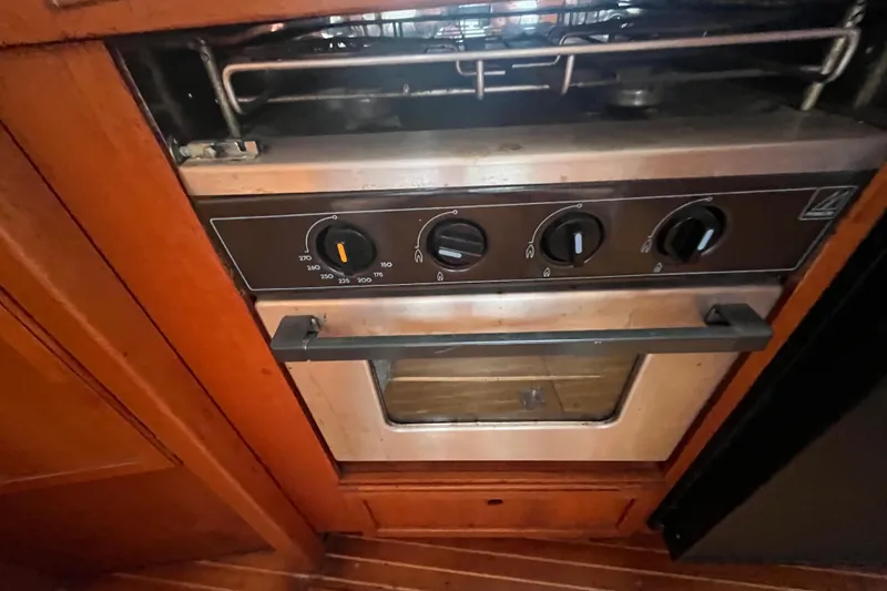 Slide: The Image of Built-in oven on 1986 Nauticat 33' yacht with wooden cabinetry. - 44