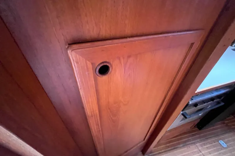 Slide: The Image of Wooden interior door on a 1986 Nauticat 33' sailboat, showcasing craftsmanship. - 56