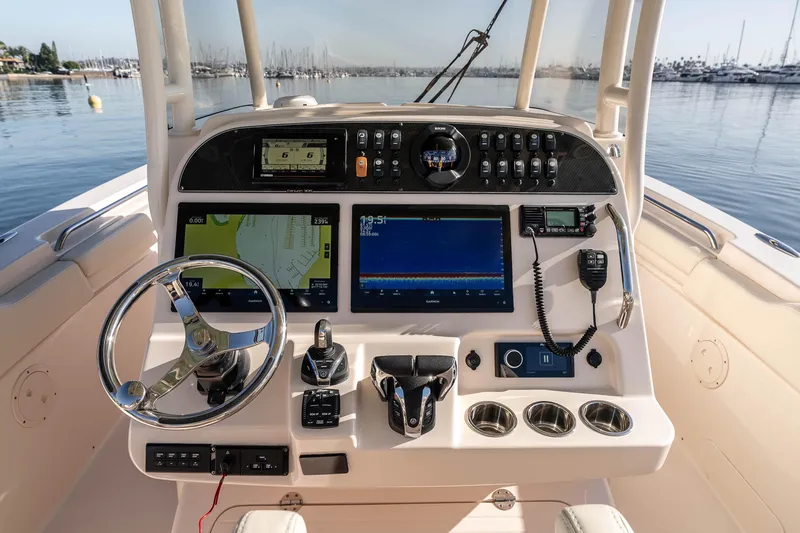 Slide: The Image of 2022 Grady-White Canyon 306 helm with advanced navigation and control systems. - 21