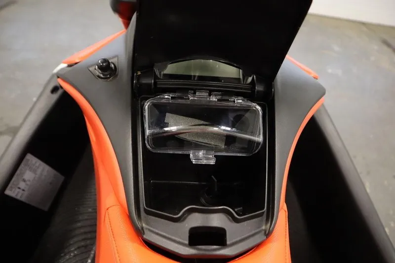 Slide: The Image of 2025 Sea-Doo Spark Trixx storage compartment, open view, showcasing interior design. - 14