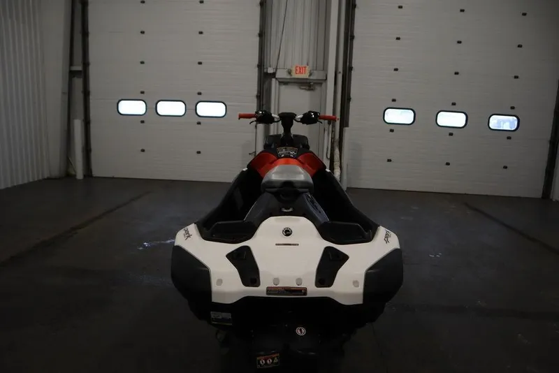 Slide: The Image of 2025 Sea-Doo Spark Trixx for 1 in a garage, rear view. - 4