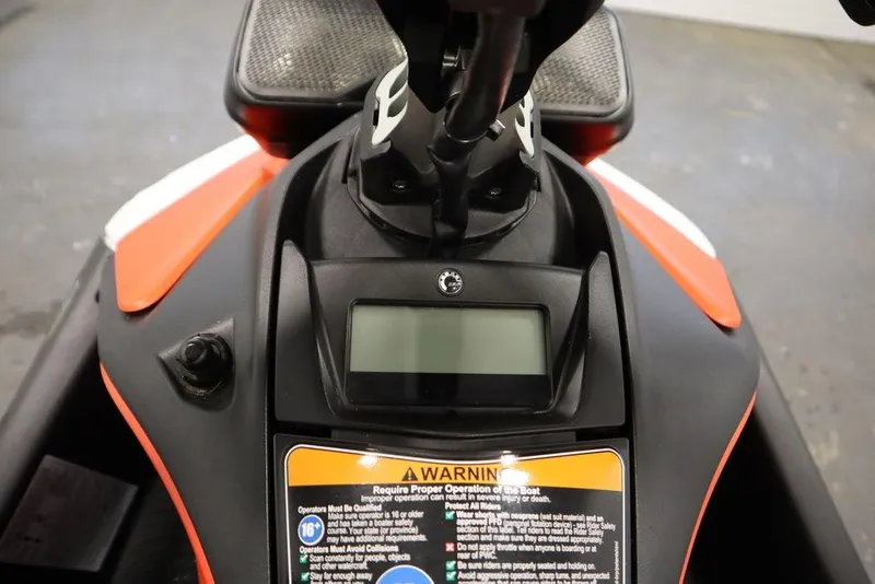 Slide: The Image of 2025 Sea-Doo Spark Trixx dashboard with warning label and display screen. - 8