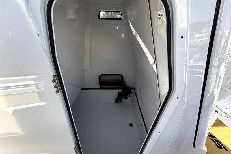 Slide: The Image of Interior view of 2026 Sportsman Masters 247OE Bay Boat cabin with window. - 18