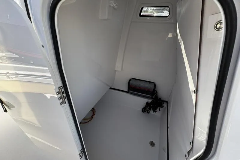 Slide: The Image of Interior view of 2026 Sportsman Masters 247OE Bay Boat storage compartment. - 19