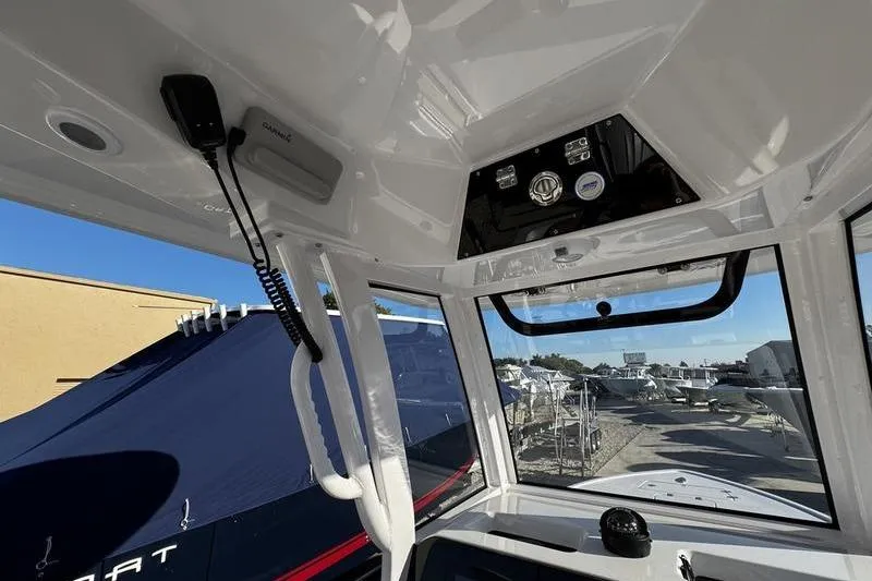 Slide: The Image of Interior view of 2026 Sportsman Masters 247OE Bay Boat cockpit with control panel. - 23