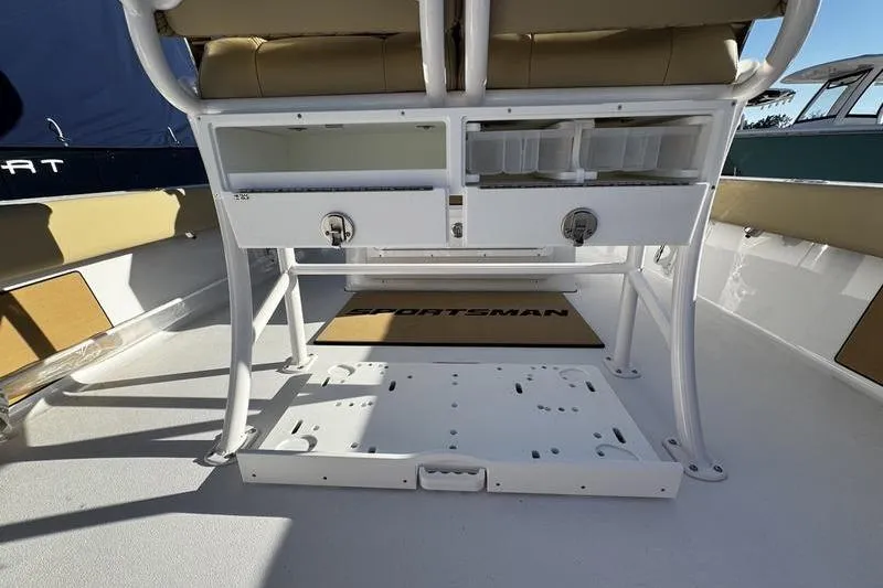 Slide: The Image of 2026 Sportsman Masters 247OE Bay Boat interior with seating and storage compartments. - 28