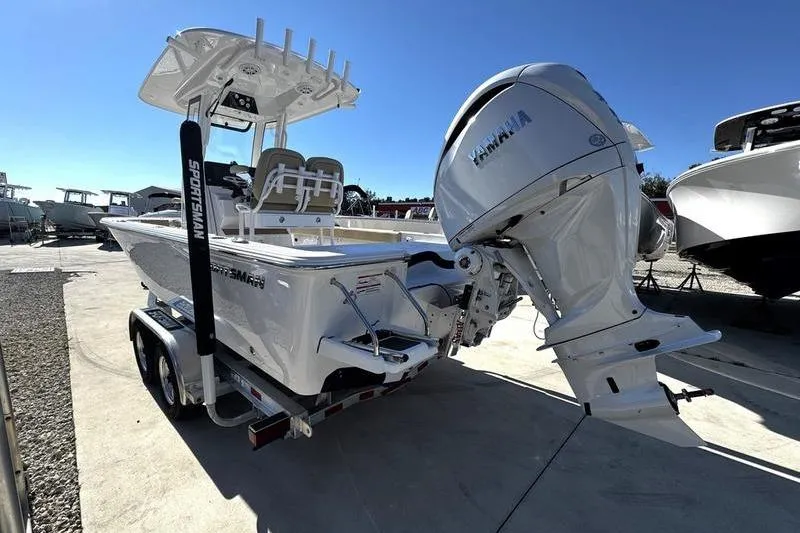 Slide: The Image of 2026 Sportsman Masters 247OE Bay Boat with Yamaha engine on trailer, outdoor display. - 8
