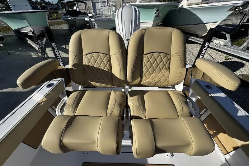 Slide: The Image of 2026 Sportsman Masters 247OE Bay Boat with tan leather seating and armrests. - 9