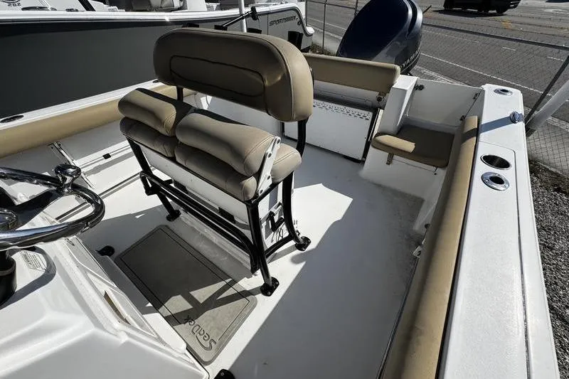 Slide: The Image of 2026 Sportsman Open 232 Center Console boat interior with seating and steering wheel. - 11