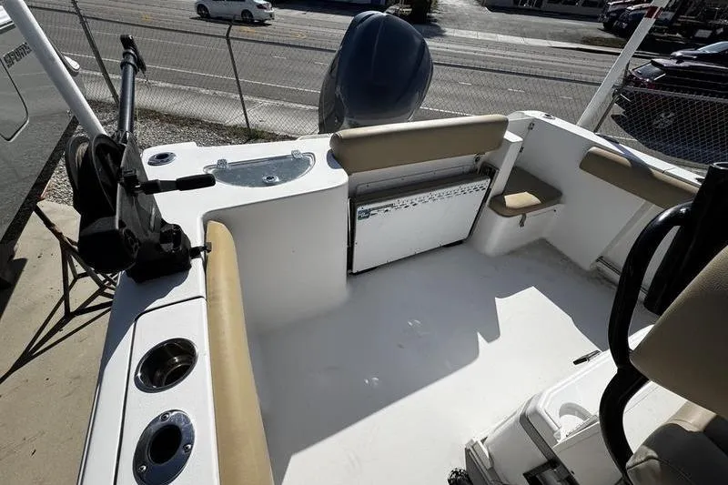Slide: The Image of 2026 Sportsman Open 232 Center Console boat interior with seating and storage. - 21