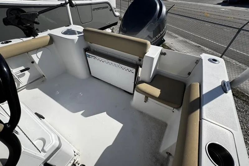Slide: The Image of 2026 Sportsman Open 232 Center Console boat interior with seating and storage. - 23