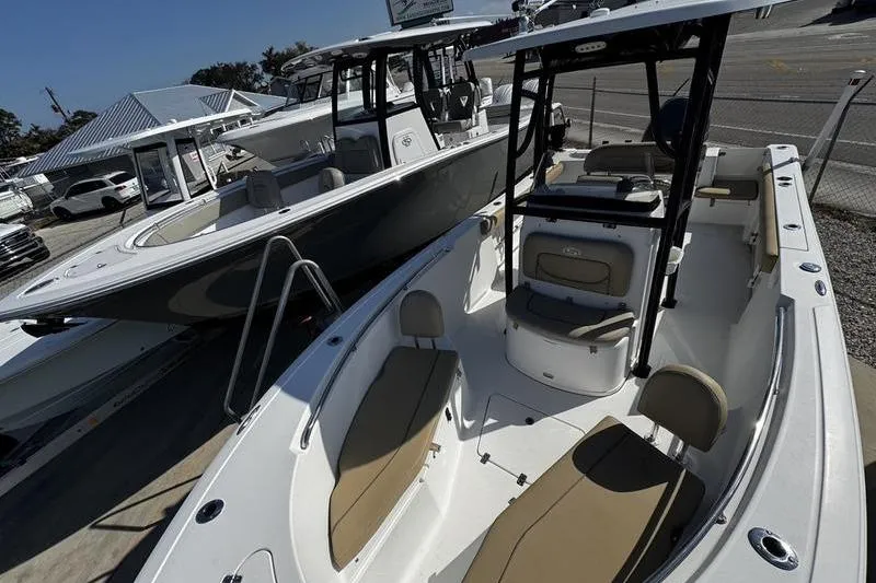 Slide: The Image of 2026 Sportsman Open 232 Center Console boat displayed at a dealership. - 3