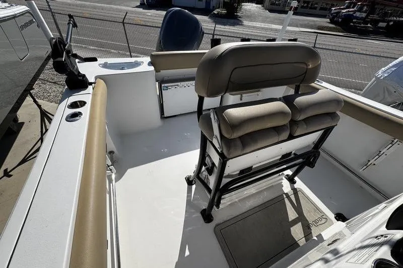Slide: The Image of 2026 Sportsman Open 232 Center Console boat interior with seating and console view. - 13