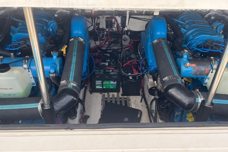Slide: The Image of Engine compartment of 1998 Tiara Yachts 2900 Coronet with dual blue engines. - 15