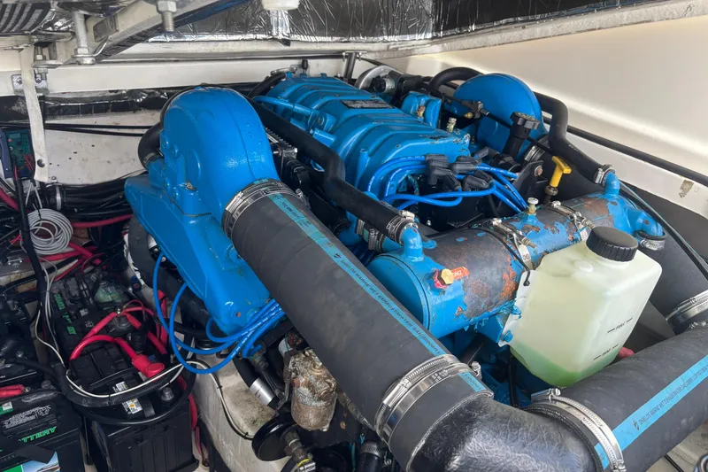 Slide: The Image of Engine compartment of a 1998 Tiara Yachts 2900 Coronet, featuring blue engine components. - 18