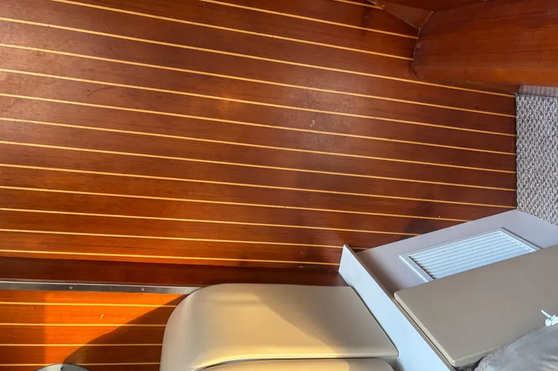 Slide: The Image of Interior of 1998 Tiara Yachts 2900 Coronet with wooden paneling and seating. - 23