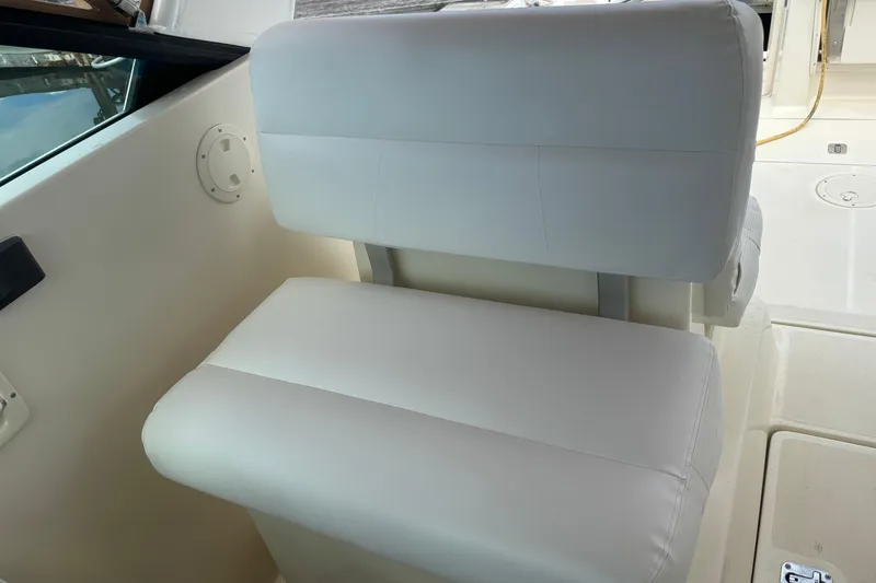 Slide: The Image of White seating on 1998 Tiara Yachts 2900 Coronet, showcasing luxury marine interior. - 32