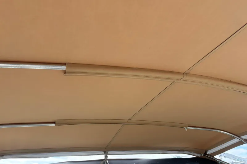 Slide: The Image of 1998 Tiara Yachts 2900 Coronet beige canopy interior with metal supports. - 39