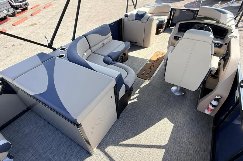 Slide: The Image of 2026 Avalon LSZ Rear Fish 24' boat interior with plush seating and modern helm. - 12