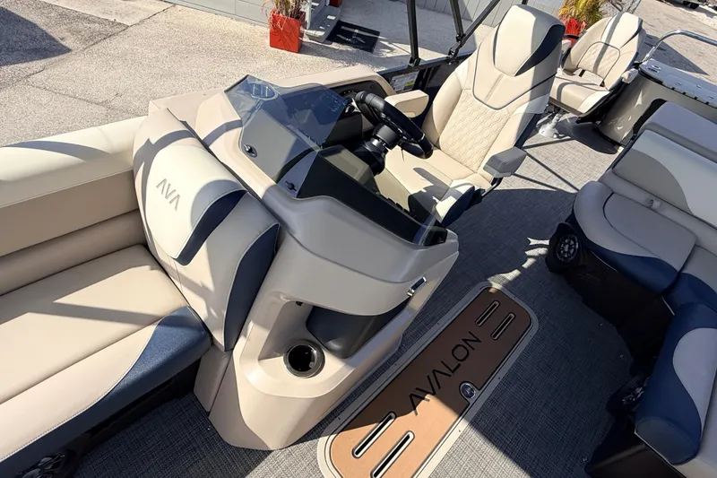 Slide: The Image of 2026 Avalon LSZ Rear Fish 24' boat interior with luxurious seating and modern helm. - 19