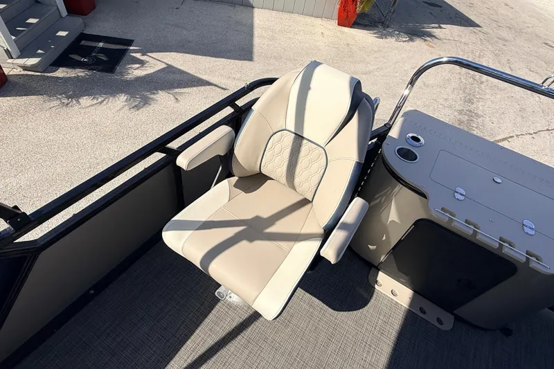 Slide: The Image of Luxurious seating on 2026 Avalon LSZ Rear Fish 24' boat, featuring beige upholstery and armrests. - 27
