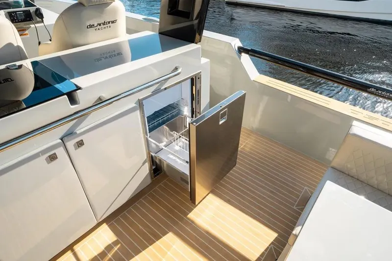 Slide: The Image of De Antonio Yachts D50 OPEN 2026 with open fridge on deck. - 16