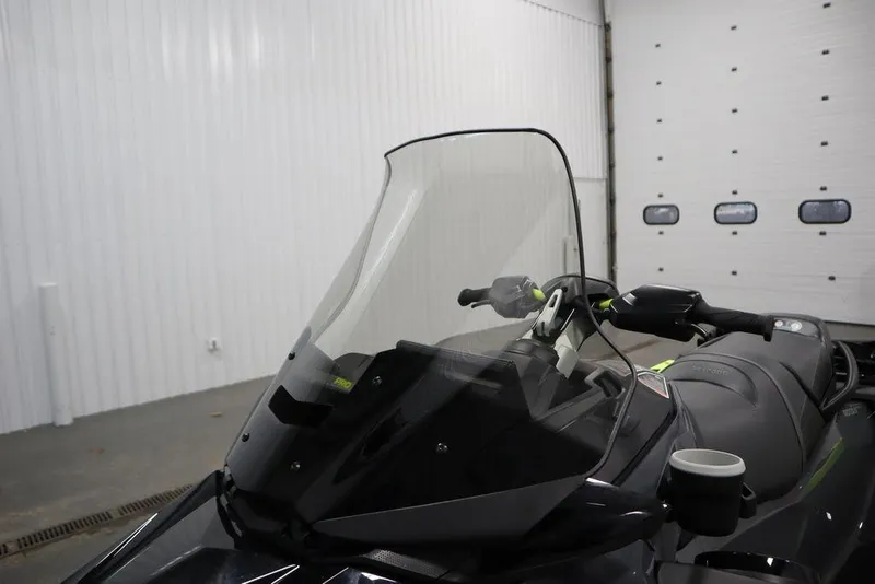 Slide: The Image of 2026 Sea-Doo Explorer Pro 170 with windshield in a garage setting. - 11