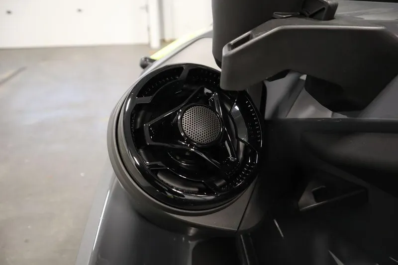 Slide: The Image of Close-up of 2026 Sea-Doo Explorer Pro 170 speaker detail, showcasing sleek black design. - 16