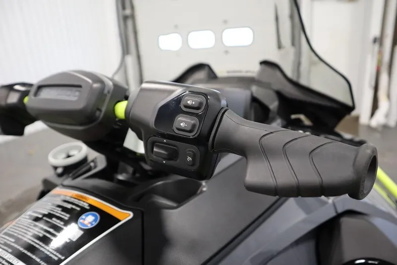 Slide: The Image of 2026 Sea-Doo Explorer Pro 170 handlebar controls in a garage setting. - 14