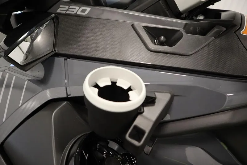 Slide: The Image of 2026 Sea-Doo Explorer Pro 170 dashboard with cup holder and control panel. - 17