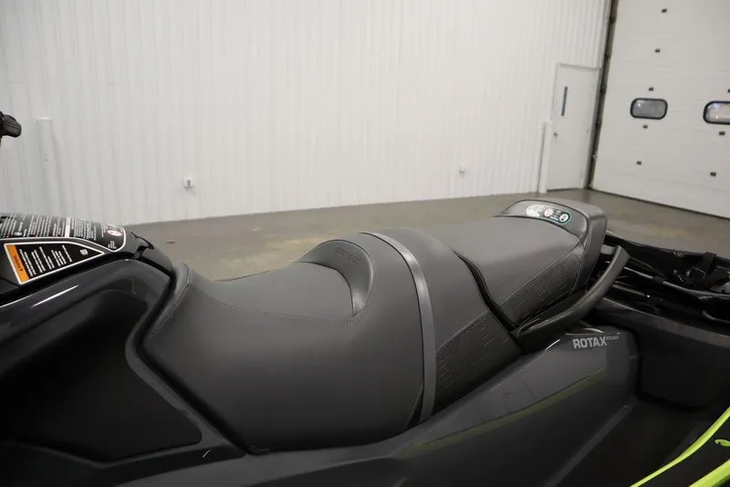 Slide: The Image of 2026 Sea-Doo Explorer Pro 170 jet ski seat in a showroom setting. - 18