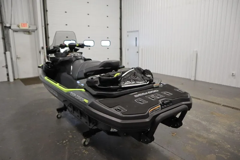 Slide: The Image of 2026 Sea-Doo Explorer Pro 170 jet ski in a garage setting. - 6