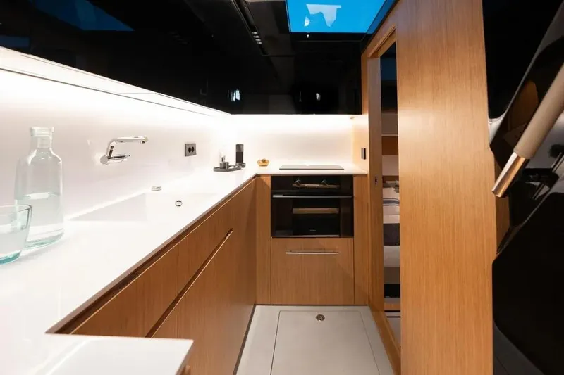 Slide: The Image of Modern kitchen on the De Antonio Yachts D60, 2026 model. - 16