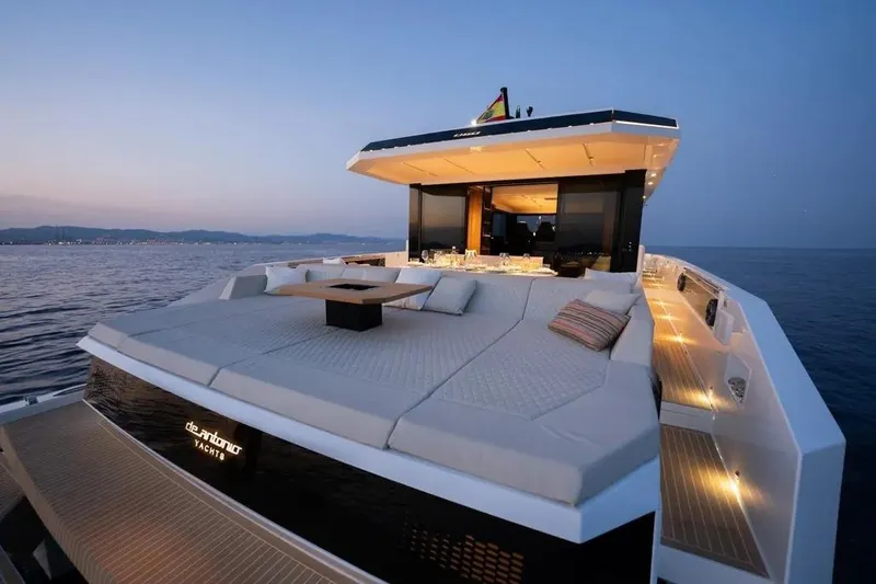 Slide: The Image of Luxury yacht De Antonio D60, 2026, at sunset on the sea. - 13