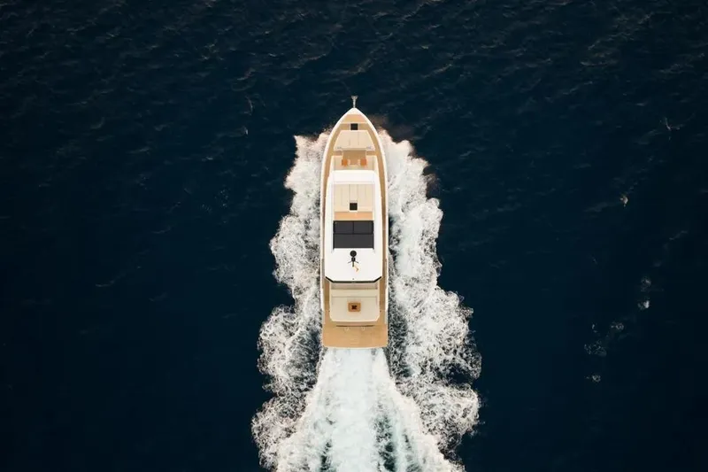 Slide: The Image of Aerial view of 2026 De Antonio Yachts D60 cruising at sea. - 3