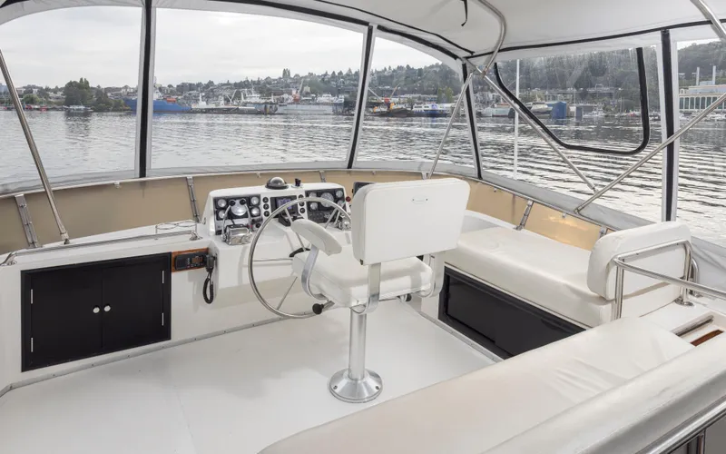 Slide: The Image of Cockpit of 1991 Ocean Alexander 440 Sundeck CPMY on calm waters. - 13