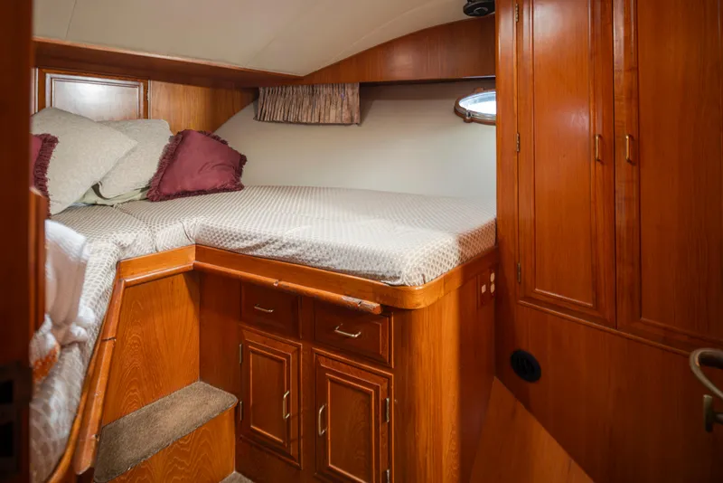 Slide: The Image of 1991 Ocean Alexander 440 Sundeck CPMY interior, cozy cabin with wood paneling. - 33