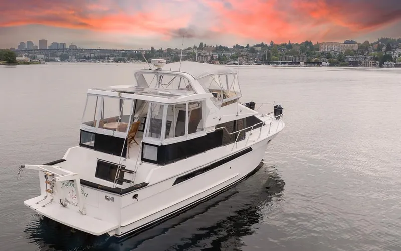 Slide: The Image of 1991 Ocean Alexander 440 Sundeck CPMY at sunset on calm waters. - 4